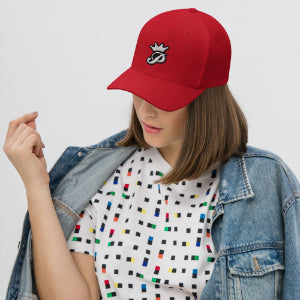 Model wearing a red Punlord fitted cap with logo, paired with a patterned shirt and denim jacket.